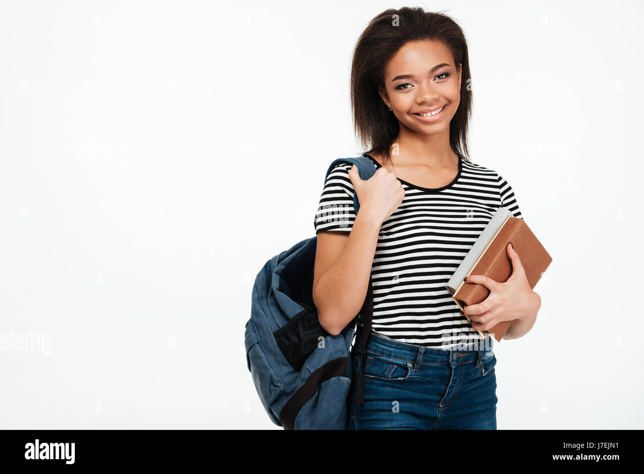 Portrait of a cheerful smiling african student girl wearing backpack ...