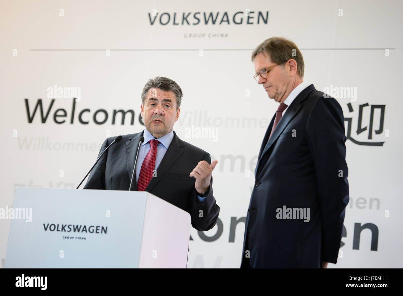 China. 24th May, 2017.German Foreign Minister Sigmar Gabriel (L) speaks on a podium along with the Chairman of the Volkswagen Group China, Jochem Heizmann, during a visit to the VW/Audi Research and Development Centre in Beijing, China, 24 May 2017. Minister Gabriel visited for one day the capital of the People's Republic of China. Photo: Gregor Fischer/dpa/Alamy Live News Stock Photo