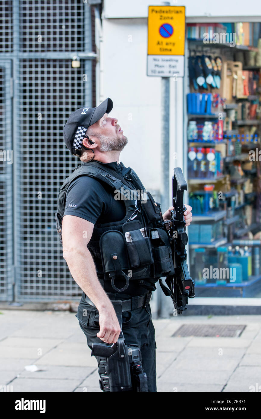 Winchester, Hampshire, United Kingdom. 24 May 2017. Armed police patrol Winchester Town Centre and Railway Station after the UK terrorism threat level is increased from severe to the highest level; critical. Operation temperer is in place resulting in a higher armed police presence and the military drafted in to protect major land marks around the country. © Will Bailey / Alamy Live News Stock Photo