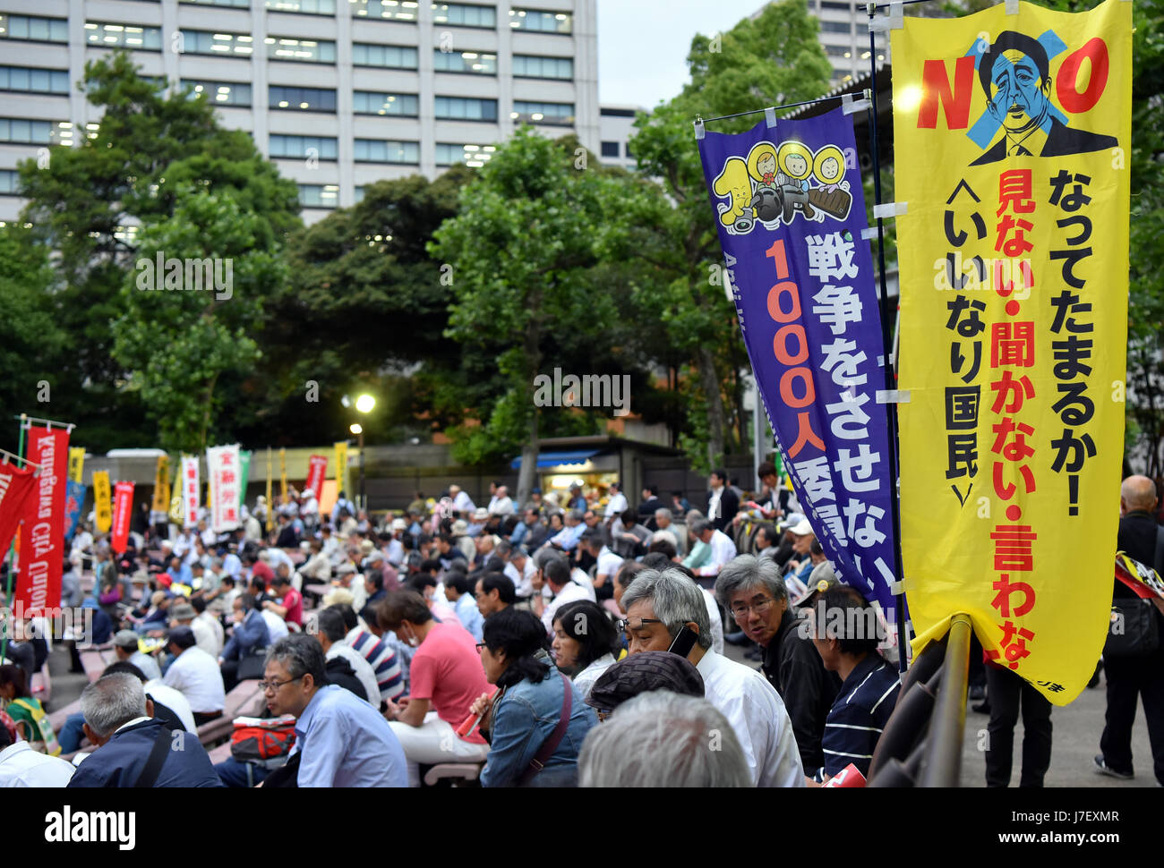 May 24, 2017, Tokyo, Japan - Protesters rally at a park near the Diet building in Tokyo on Wednesday night, May 24, 2017, opposing the contentious conspiracy bill that was rammed through the Lower House by Prime Minister Shinzo Abe's ruling bloc the day before. The bill would revise the anti-organized crime law and is purportedly aimed at permitting law enforcement to crack down on people suspected of being terrorists who conspire to commit crimes. It is expected to cover as many as 277 crimes, and there is a concern that it could also be used to restrict freedom. (Photo by Natsuki Sakai/AFLO) Stock Photo