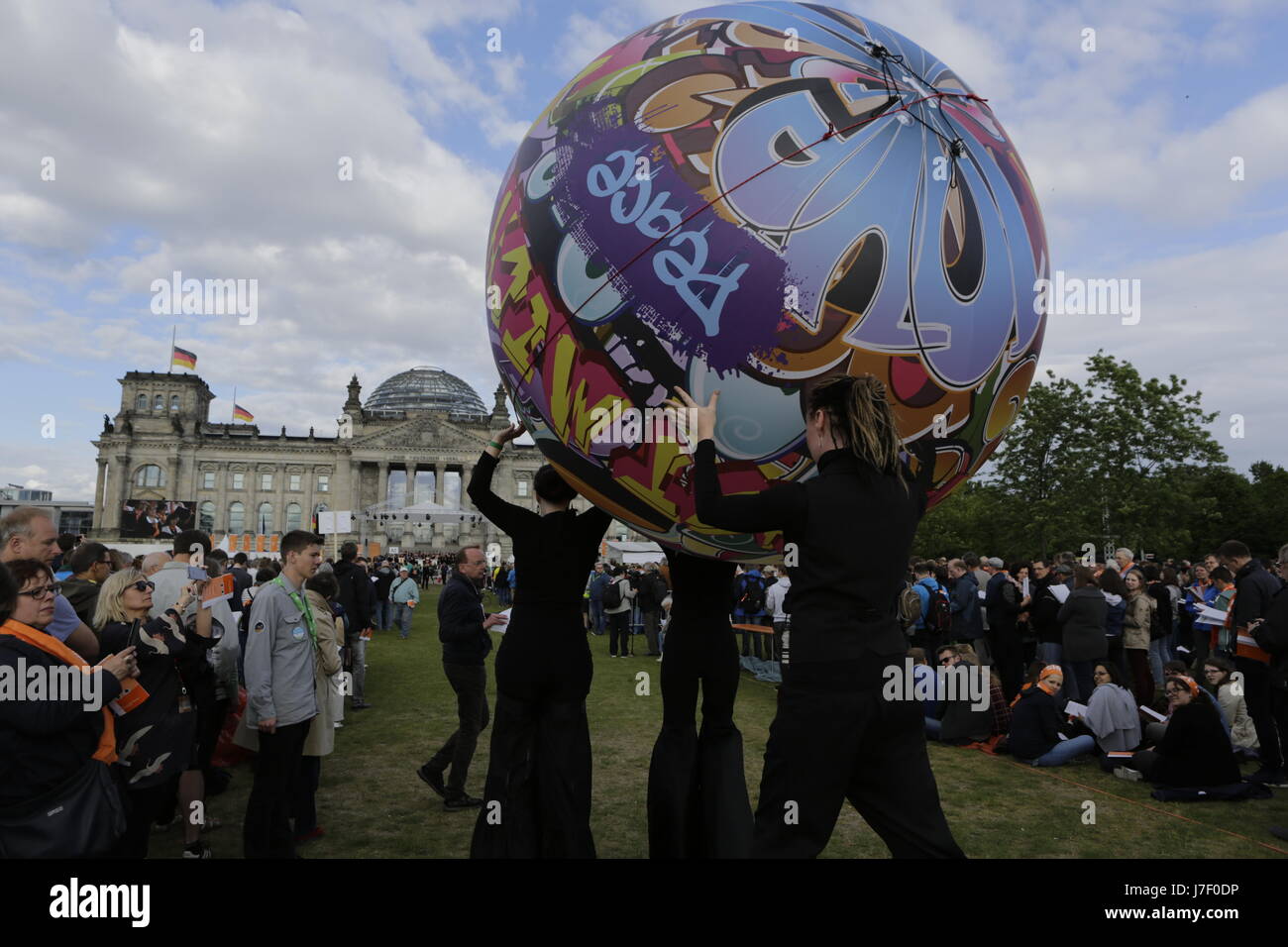 A large ball, created by artists' is carried through the congregation during the opening service. Tens of thousands of people attended the opening services of the 36th German Protestant Church Congress (Evangelischer Kirchentag). The Congress is held from 24. to 28. May in Berlin and more than 100,000 visitors are expected to attend. The congress coincides with the 500. anniversary of the Reformation. Photo: Cronos/Michael Debets Stock Photo