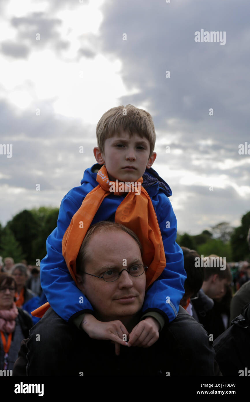 A father carries his son on his shoulders. Tens of thousands of people attended the opening services of the 36th German Protestant Church Congress (Evangelischer Kirchentag). The Congress is held from 24. to 28. May in Berlin and more than 100,000 visitors are expected to attend. The congress coincides with the 500. anniversary of the Reformation. Photo: Cronos/Michael Debets Stock Photo