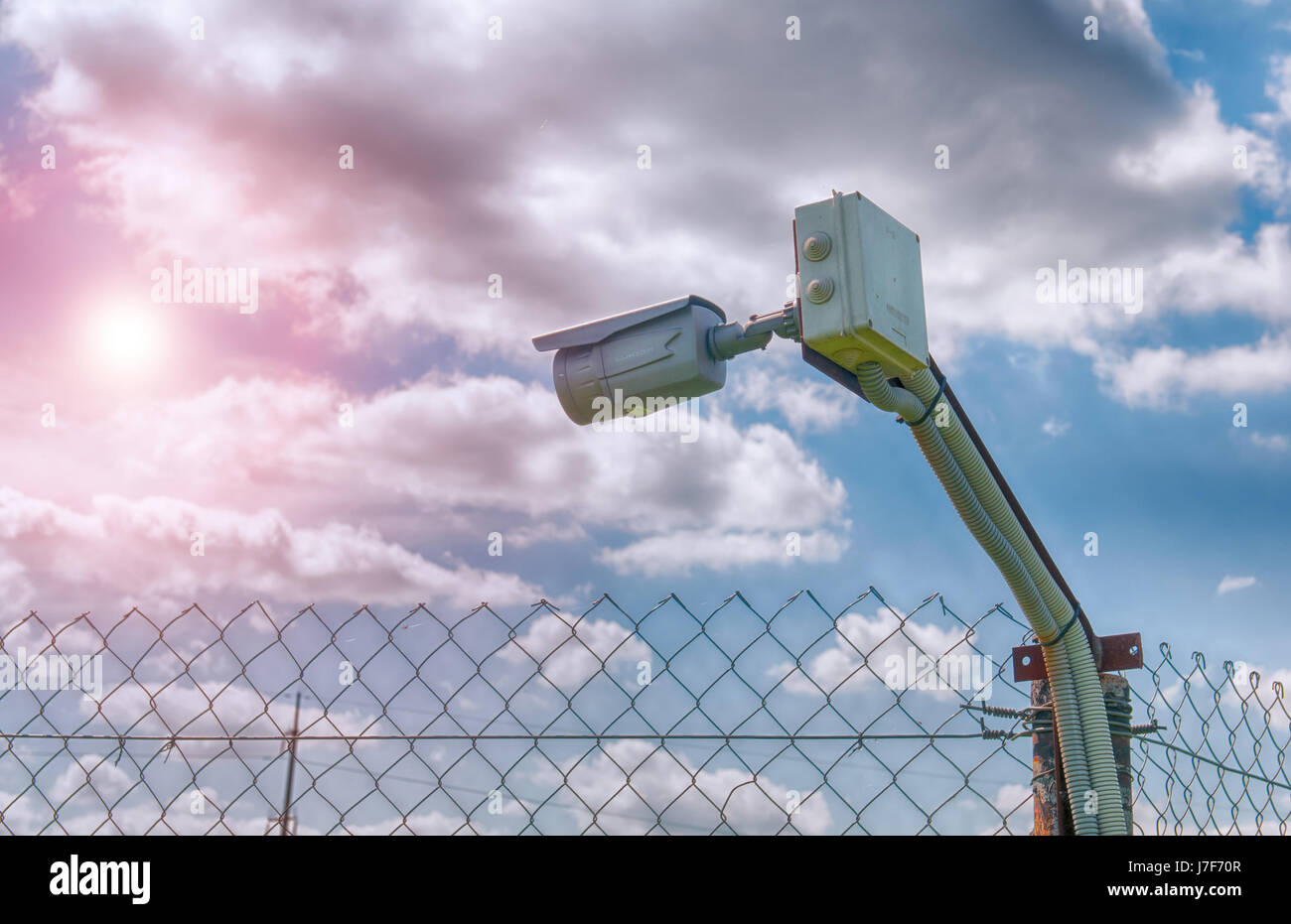 barbed wire and surveillance camera Stock Photo Alamy