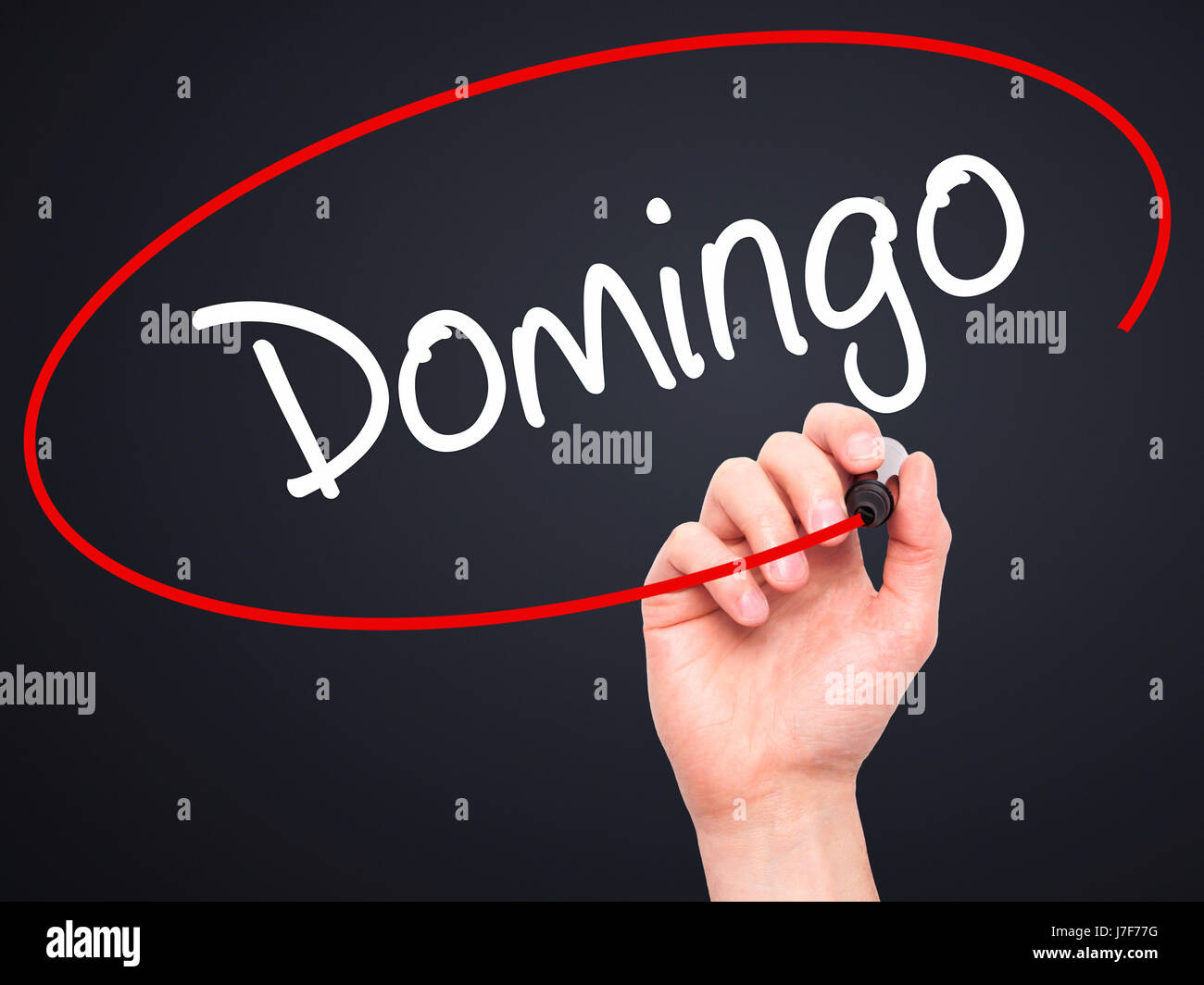 Man Hand writing Domingo (Sunday in Spanish/Portuguese) with black