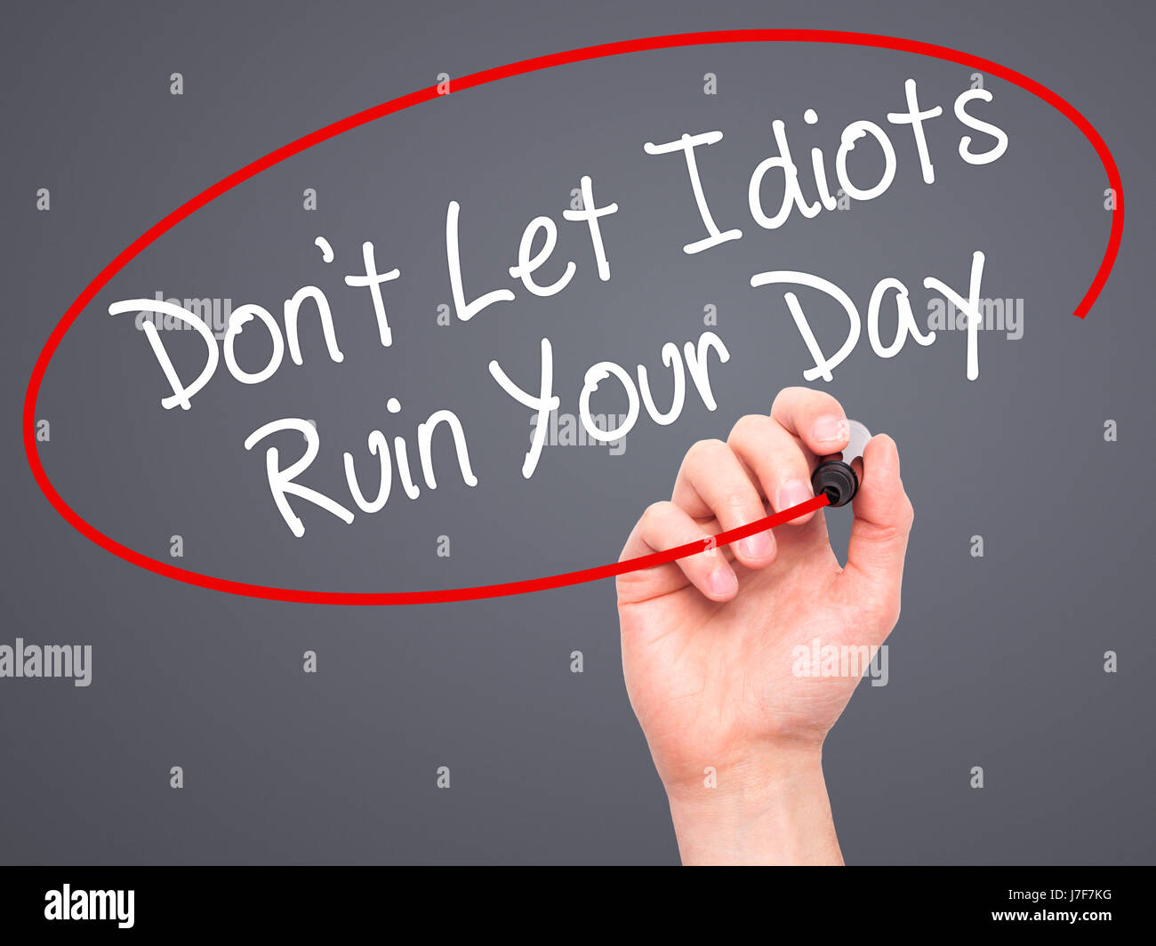 Man Hand writing Don't Let Idiots Ruin Your Day with black marker on ...