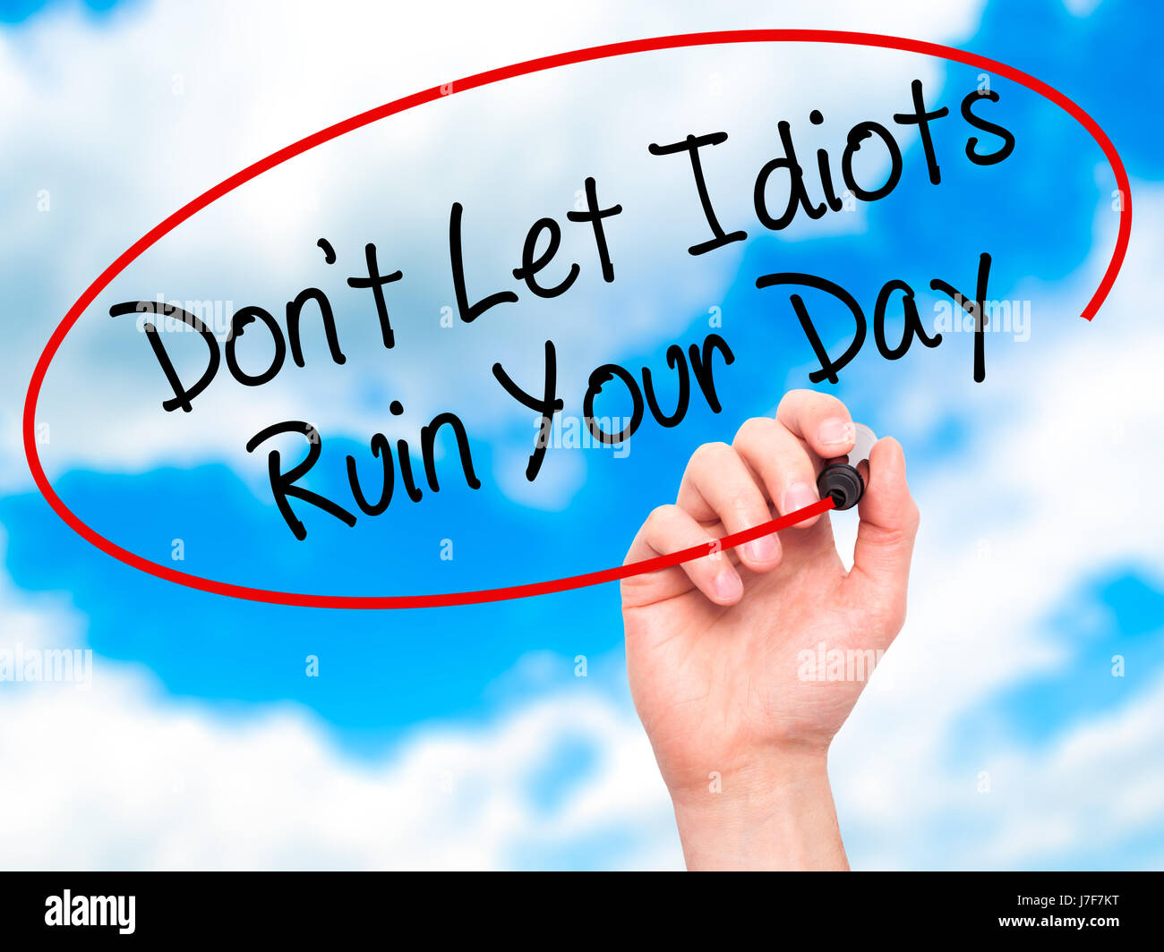 Man Hand writing Don't Let Idiots Ruin Your Day with black marker on ...