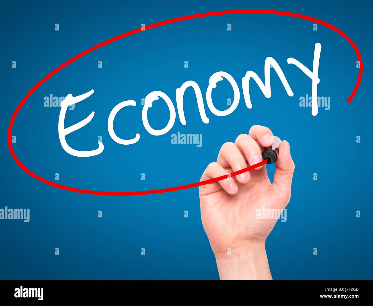Man Hand writing Economy with black marker on visual screen. Isolated ...
