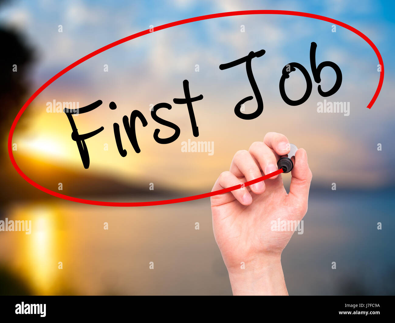 Man Hand writing First Job with black marker on visual screen. Isolated ...