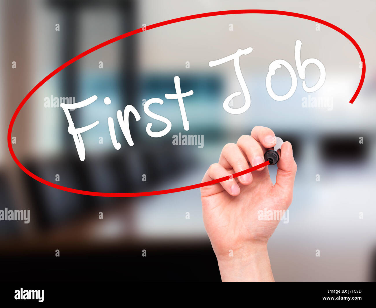 Man Hand writing First Job with black marker on visual screen. Isolated ...