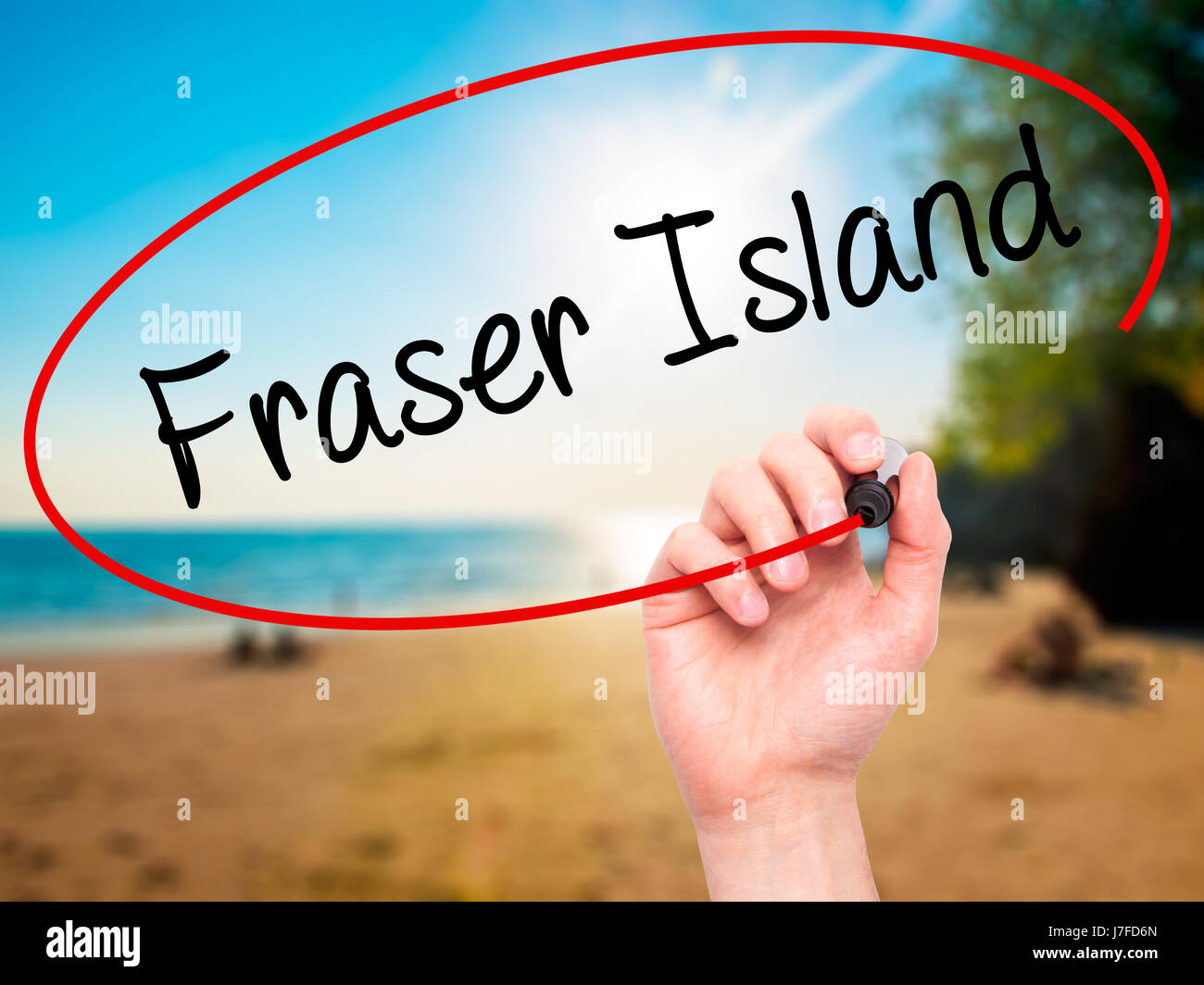 Man Hand writing Fraser Island with black marker on visual screen ...
