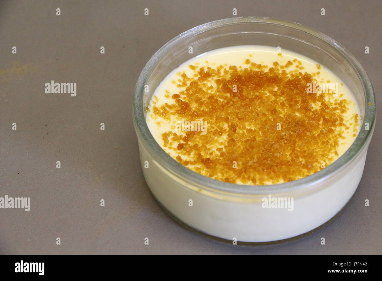 Creme brulee in a ramekin Stock Photo Alamy