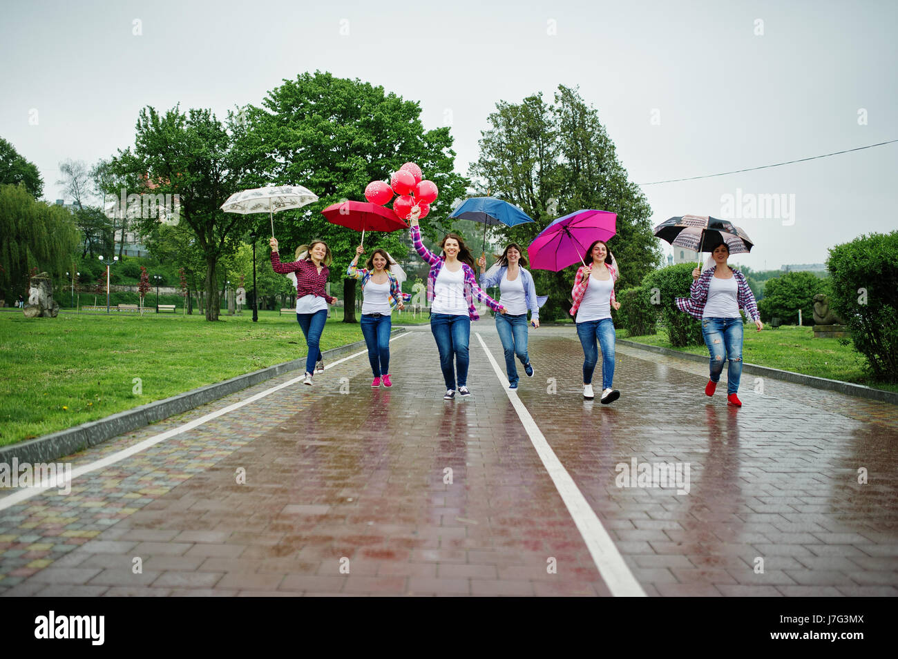 Group Of Six Girls Run And Fun At Hen Party With Umbrella Under Rain And Balloons Stock Photo Alamy Group Of Six Girls Run And Fun At Hen Party With Umbrella Under Rain And Balloons Stock Photo Alamy