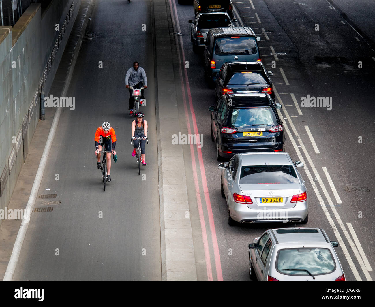 Cyclists using the TFL Cycle Superhighway in Upper Thames Street, London. Opened in 2016. Stock Photo