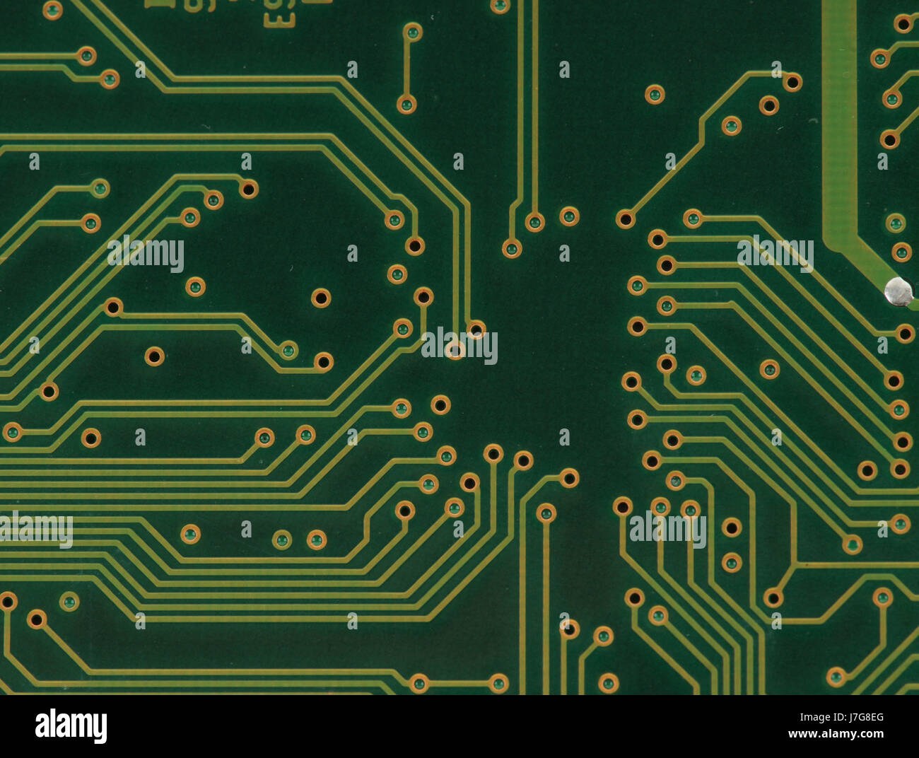 board closeup electronics holes technology circuit paths network green ...