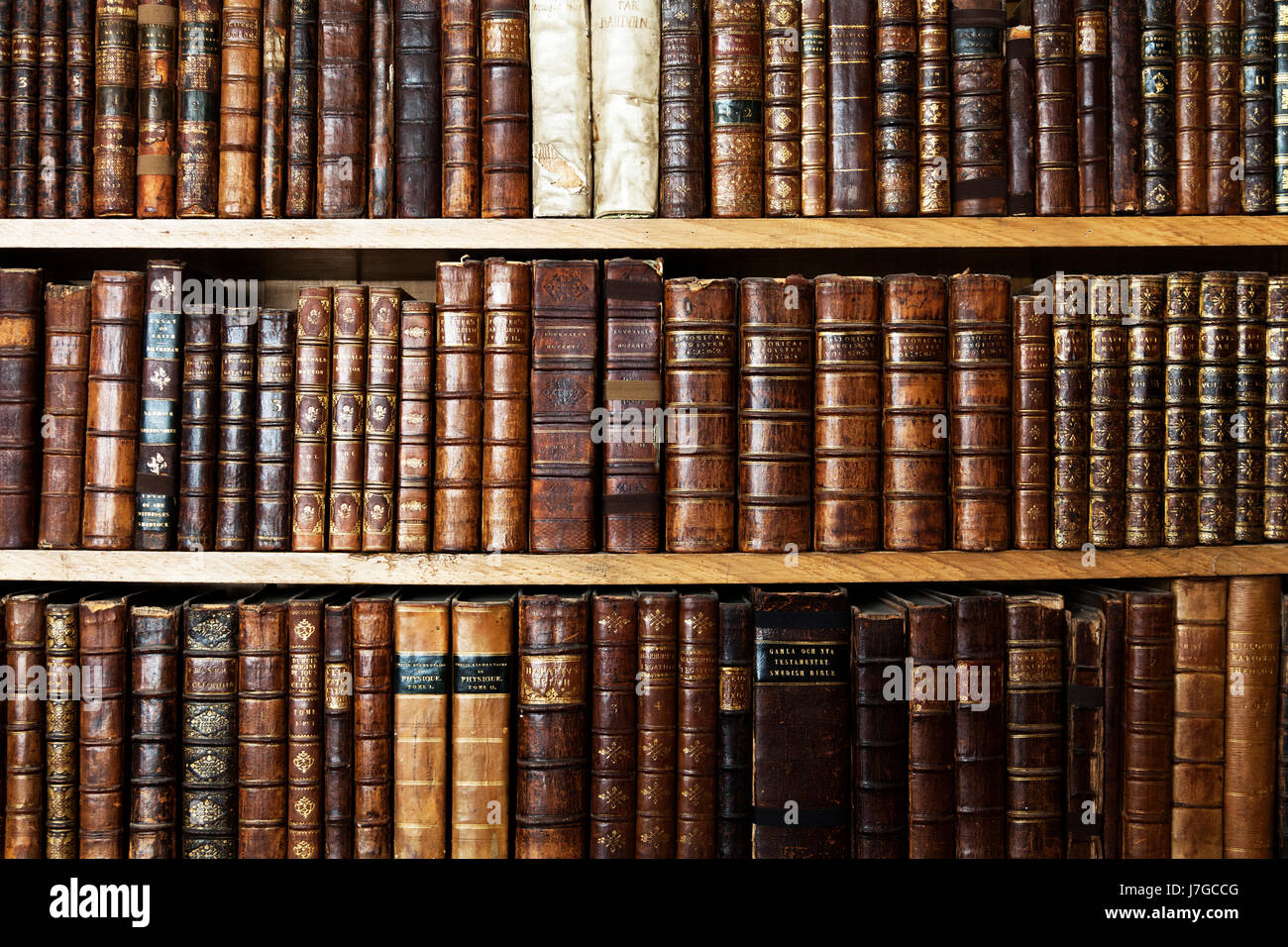 Old books in shelf, England, United Kingdom Stock Photo