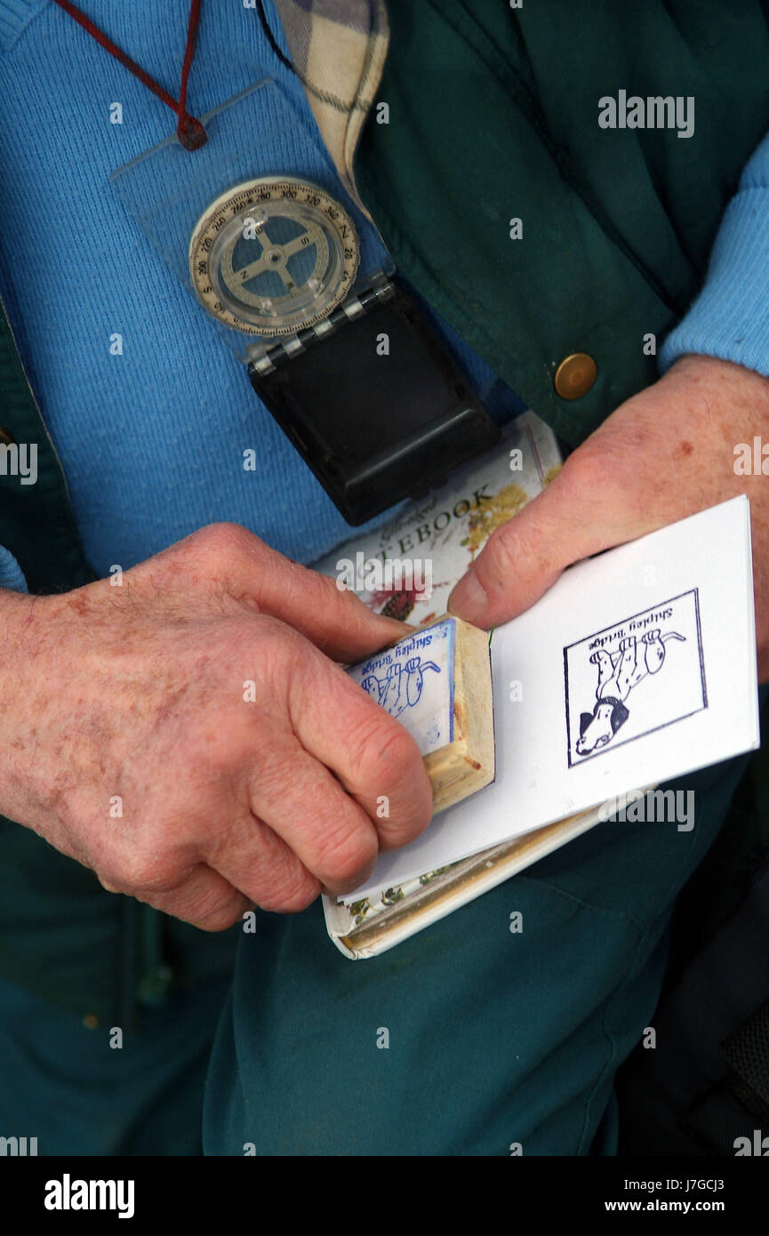 LETTERBOXING Godfrey Swinscow at Shipley Bridge, Dartmoor showing letterboxes and the stamps