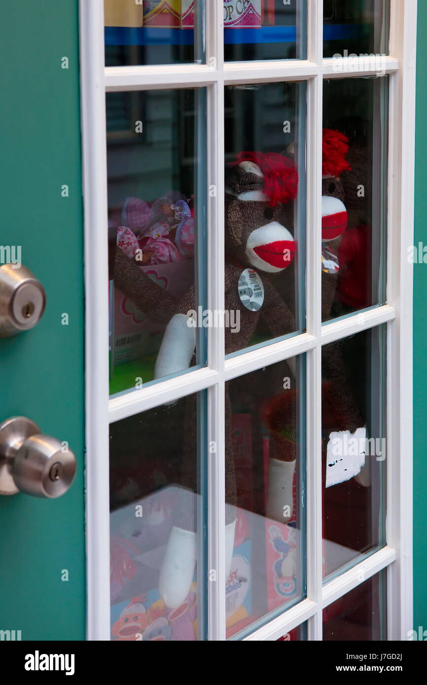 Sock Monkey Dolls Behind A Glass Door Stock Photo 142347034 Alamy