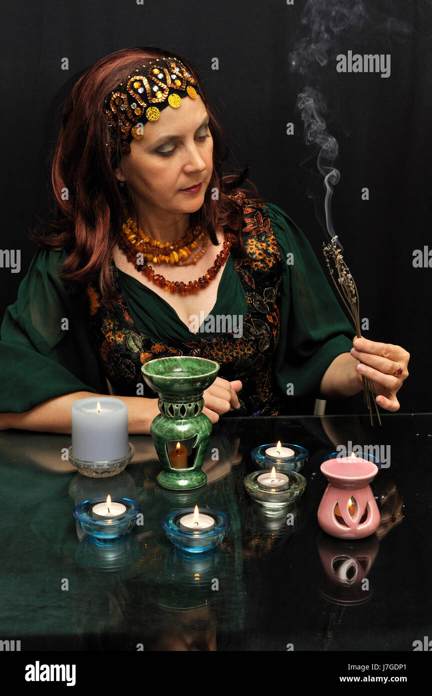 medium fortune teller occult witchcraft clairvoyant woman smoke smoking smokes Stock Photo