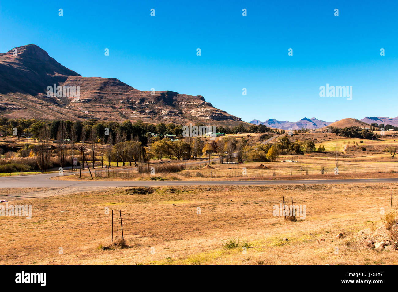 View of mountain countryside and golf course at entrance to the town of Clarens, Orange Free State in South Africa Stock Photo