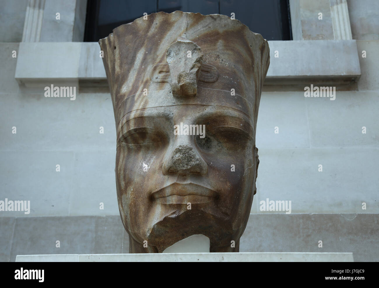 Colossal head of Egyptian pharaoh Amenhotep III. 18th Dynasty, 1400 BC. Thebes. British Museum. London. GBR Stock Photo