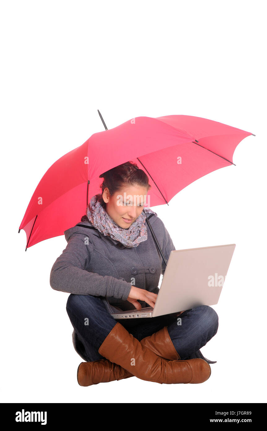 young woman with laptop and umbrella Stock Photo