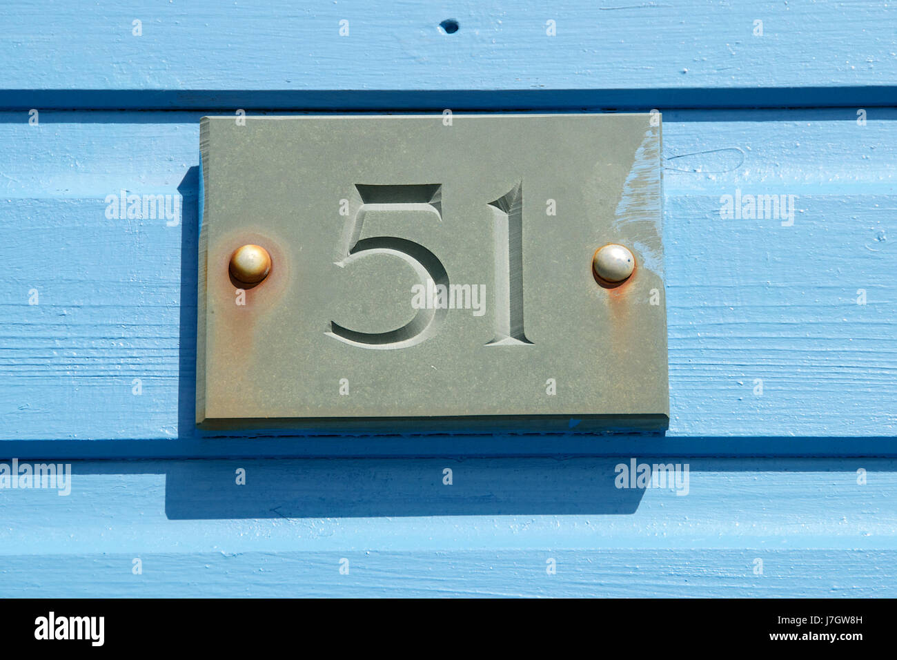The number 51 on a beach hut Stock Photo - Alamy