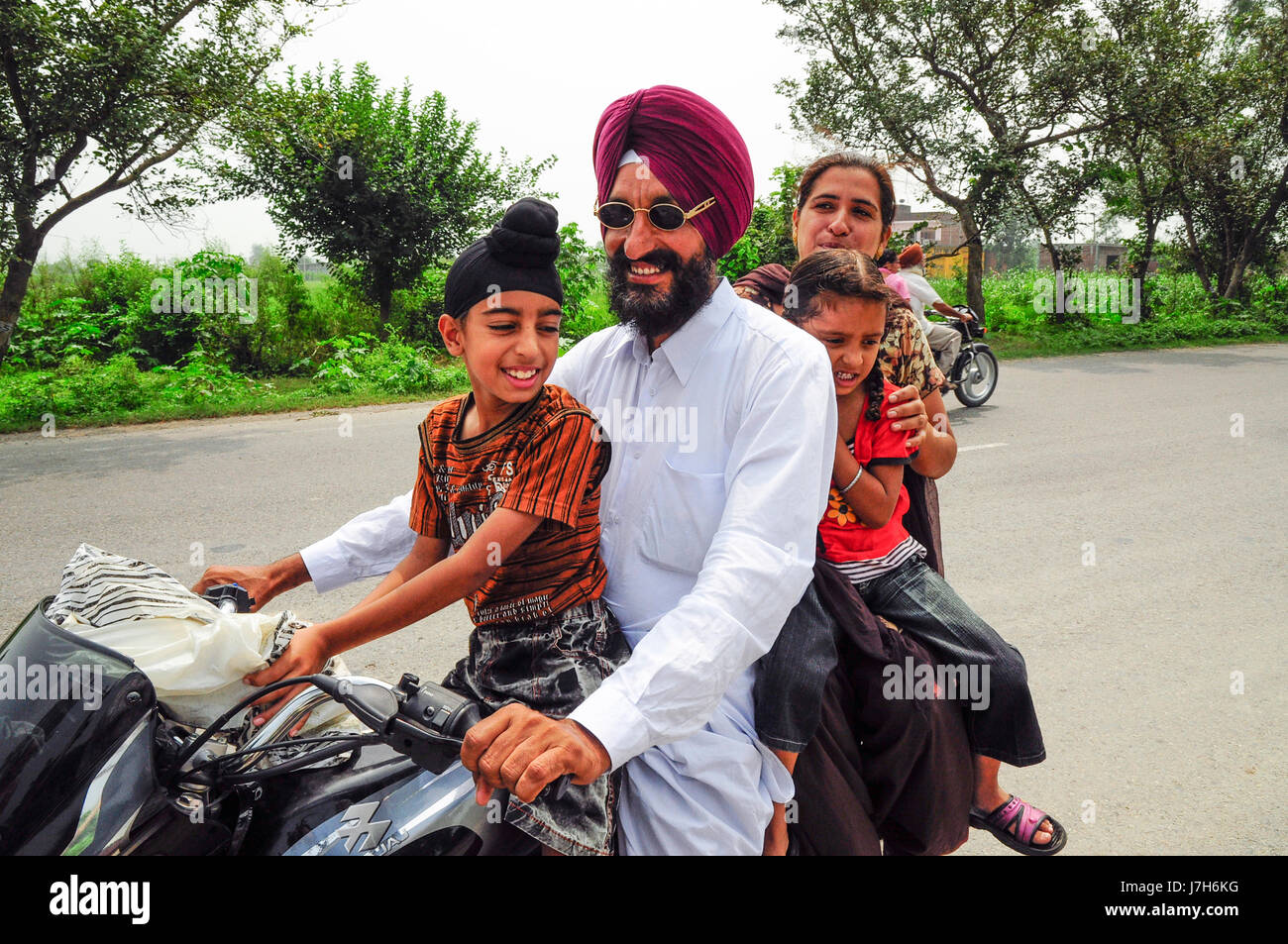 Amritsar, India, september 5, 2010: Sikh Indian family on a motorcycle. Stock Photo