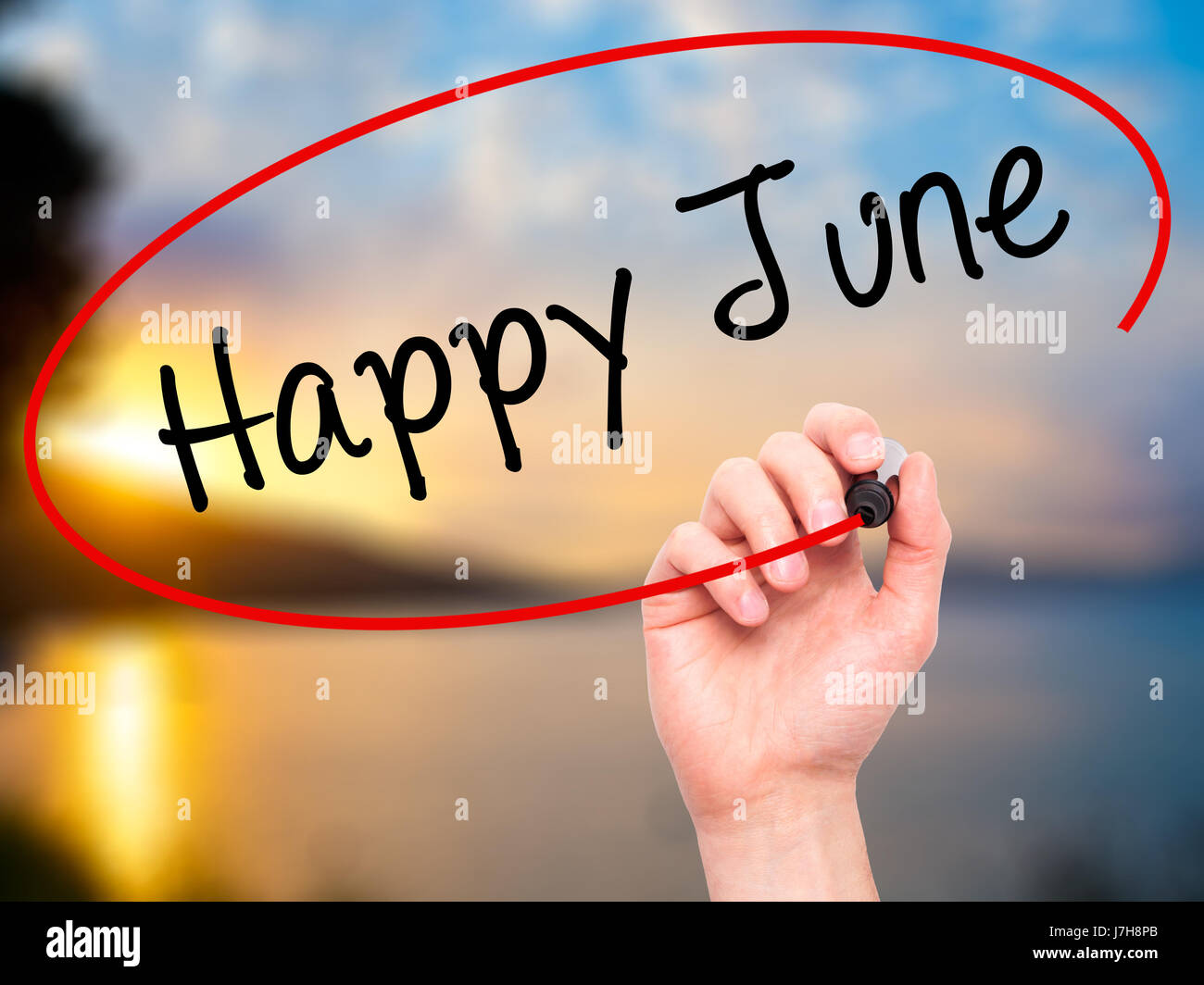 Man Hand writing Happy June with black marker on visual screen ...