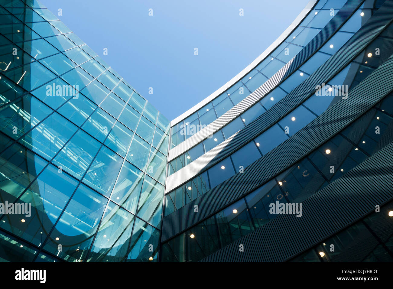 A part of modern business building against blue sky Stock Photo - Alamy
