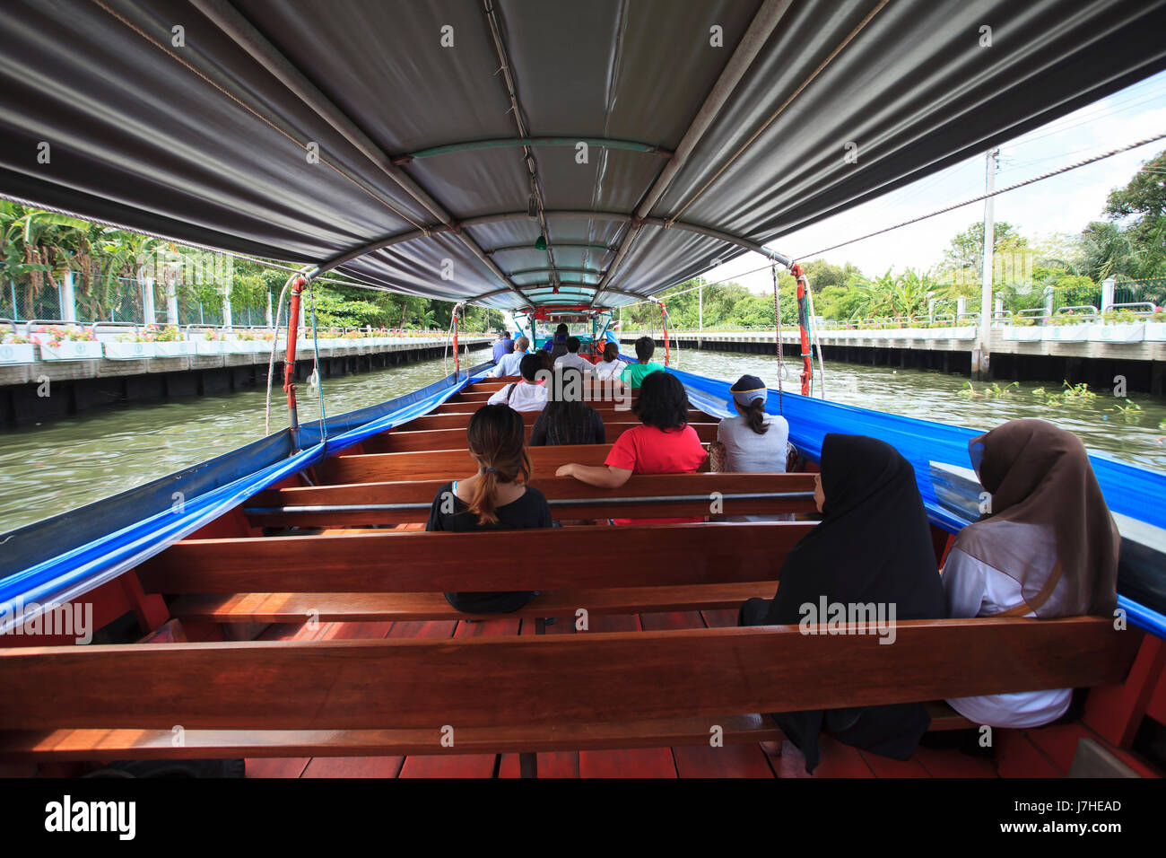 thai people daily journey by big passenger boat in klong sansaeb canal Stock Photo