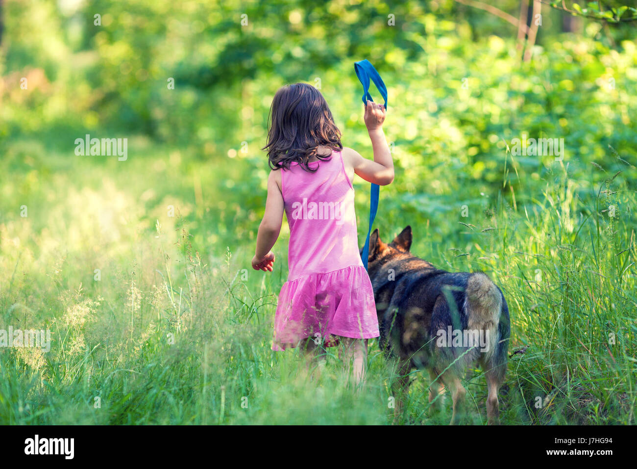 Girl holding dog leash hires stock photography and images Alamy