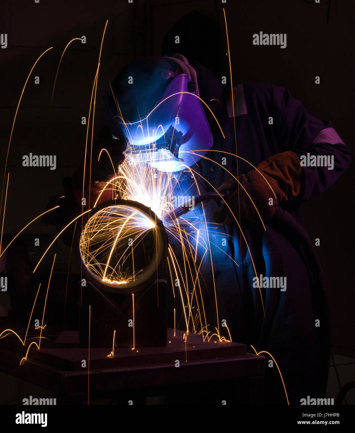engineering manufacturing welding sparks welder blue tool colour workshop Stock Photo