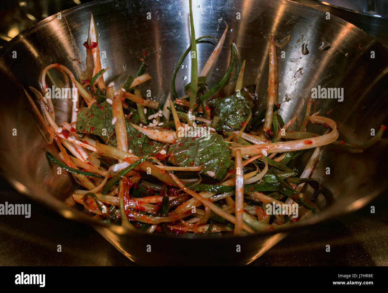 Korean side dish of pickled onion and sesame leaves Stock Photo Alamy