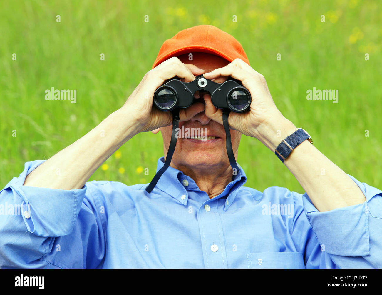 senior with binoculars Stock Photo Alamy