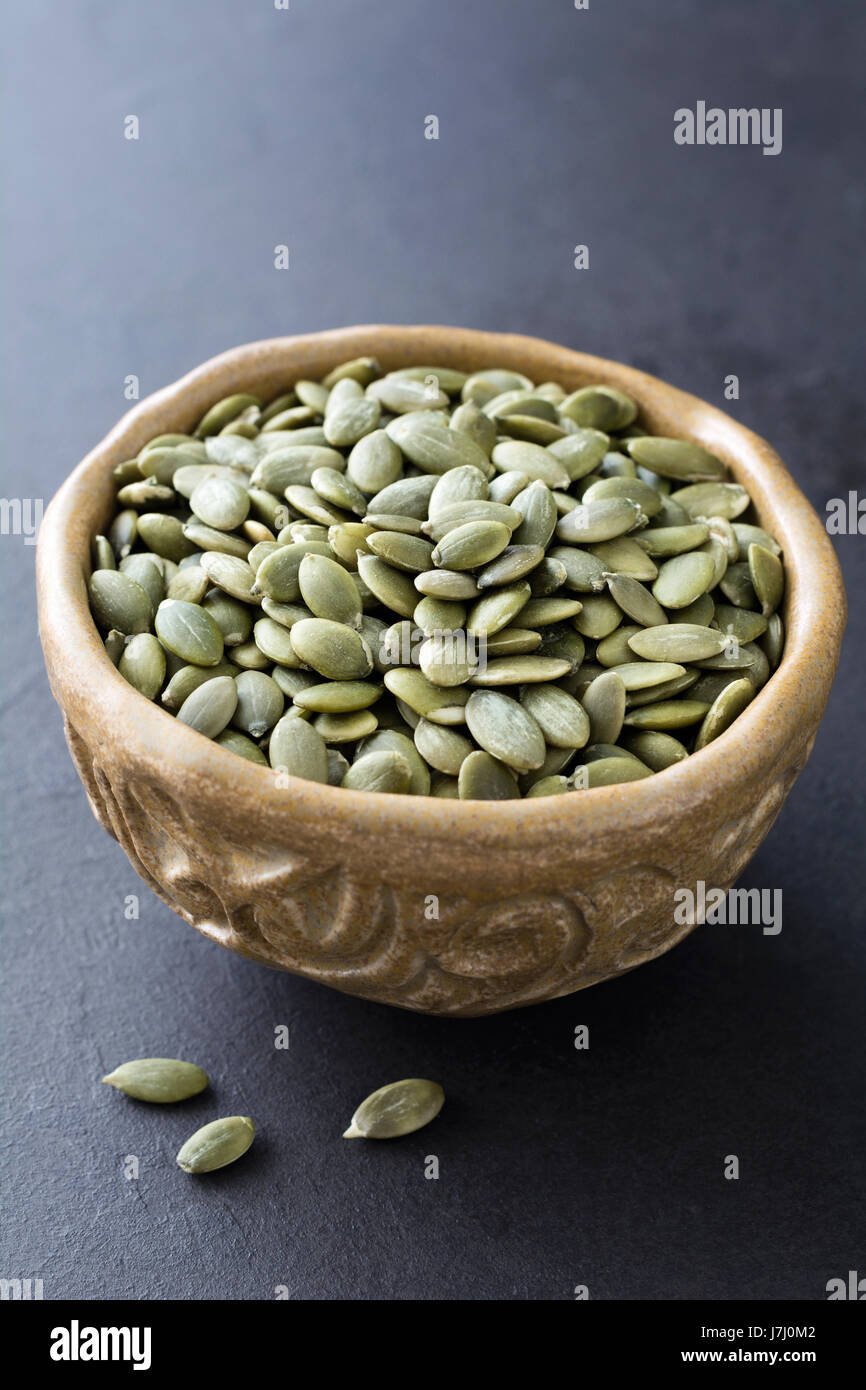 Pumpkin seeds, pepitas in a bowl Stock Photo Alamy