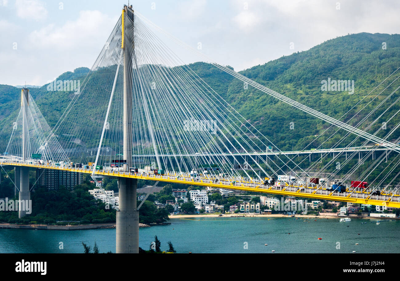 Traffic over cable-stayed Ting Kau Bridge from a distance in Hong Kong Stock Photo