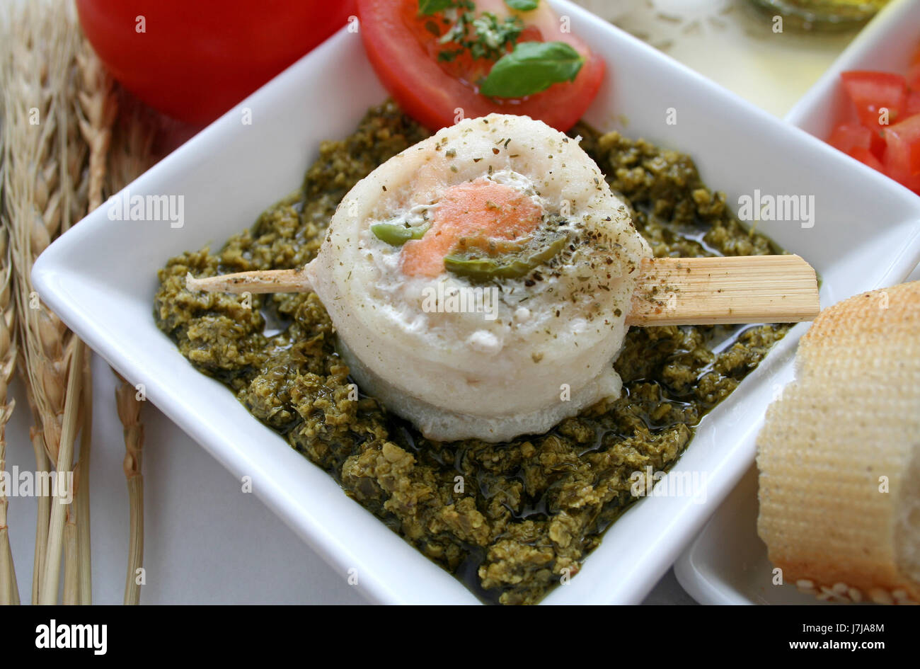 fish on pesto Stock Photo Alamy