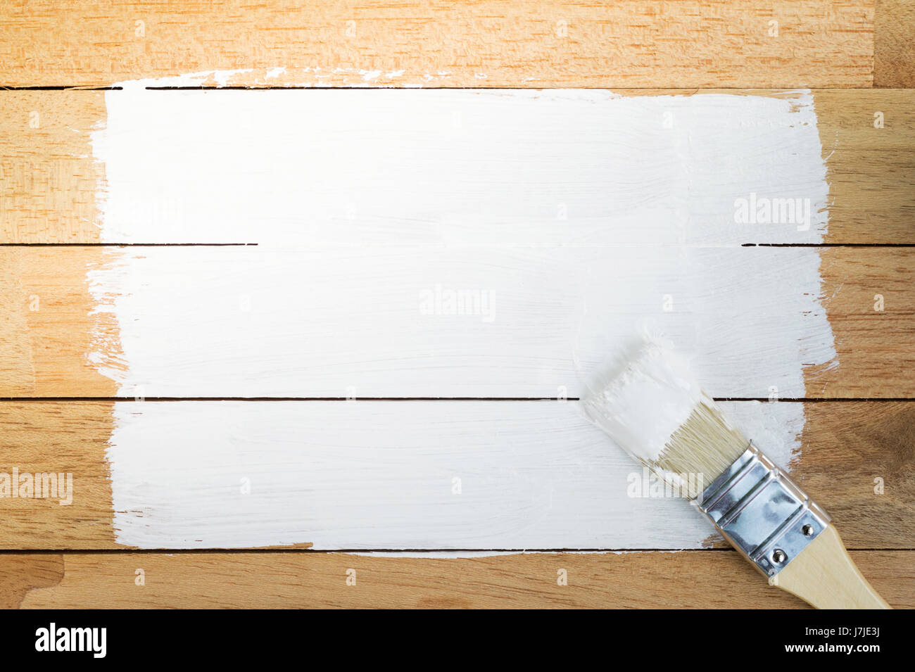 White paint space with paintbrush on wood background Stock Photo - Alamy