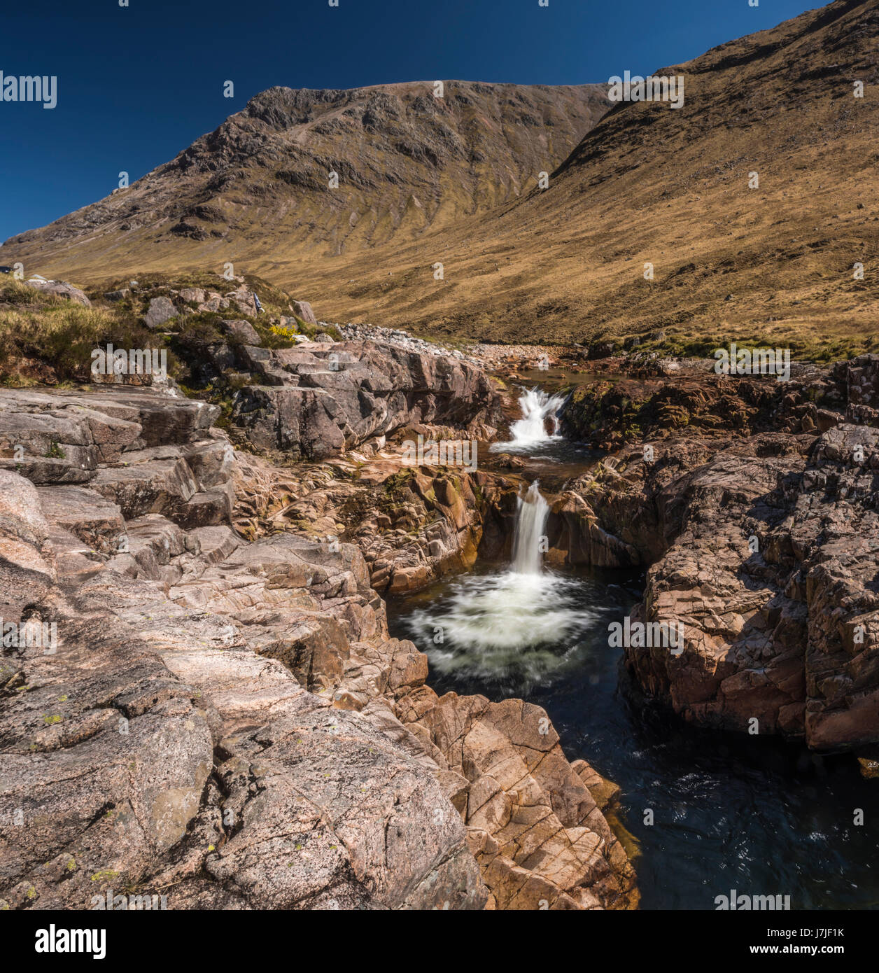 A waterfall along the River Etive, Glen Etive, Scotland, UK, on a wonderful spring day. Stock Photo