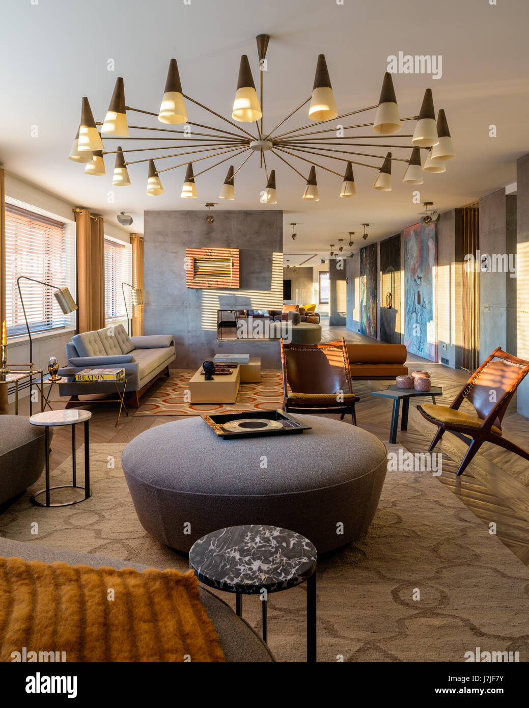 Seating area with 1950s style lights in 30 metre living space of Istanbul apartment Stock Photo
