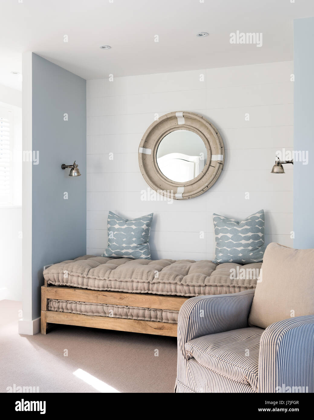 Buttoned daybed by Loaf in cosy corner with small pewter wall