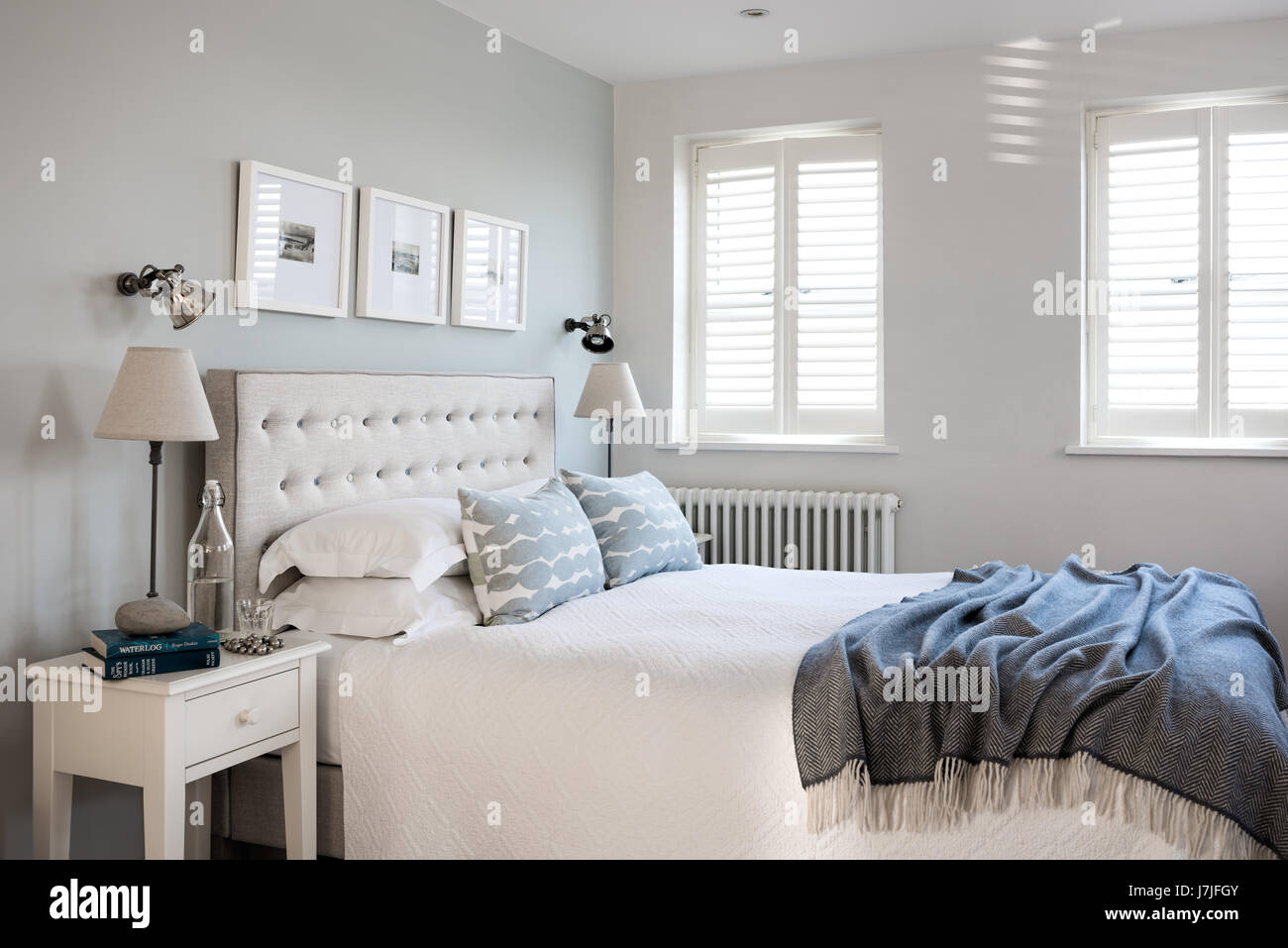 Mimosa upholstered buttoned headboard by Loaf in bedroom with cushions