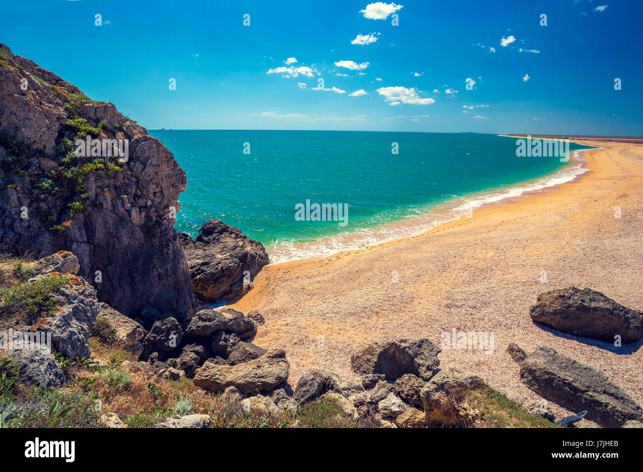 View of the open sea. Rocky seashore with blue sky. Beautiful nature. Deserted beach Stock Photo