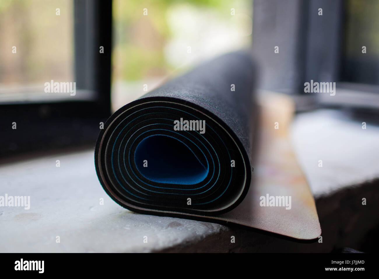 a rolled up yoga Mat Stock Photo Alamy