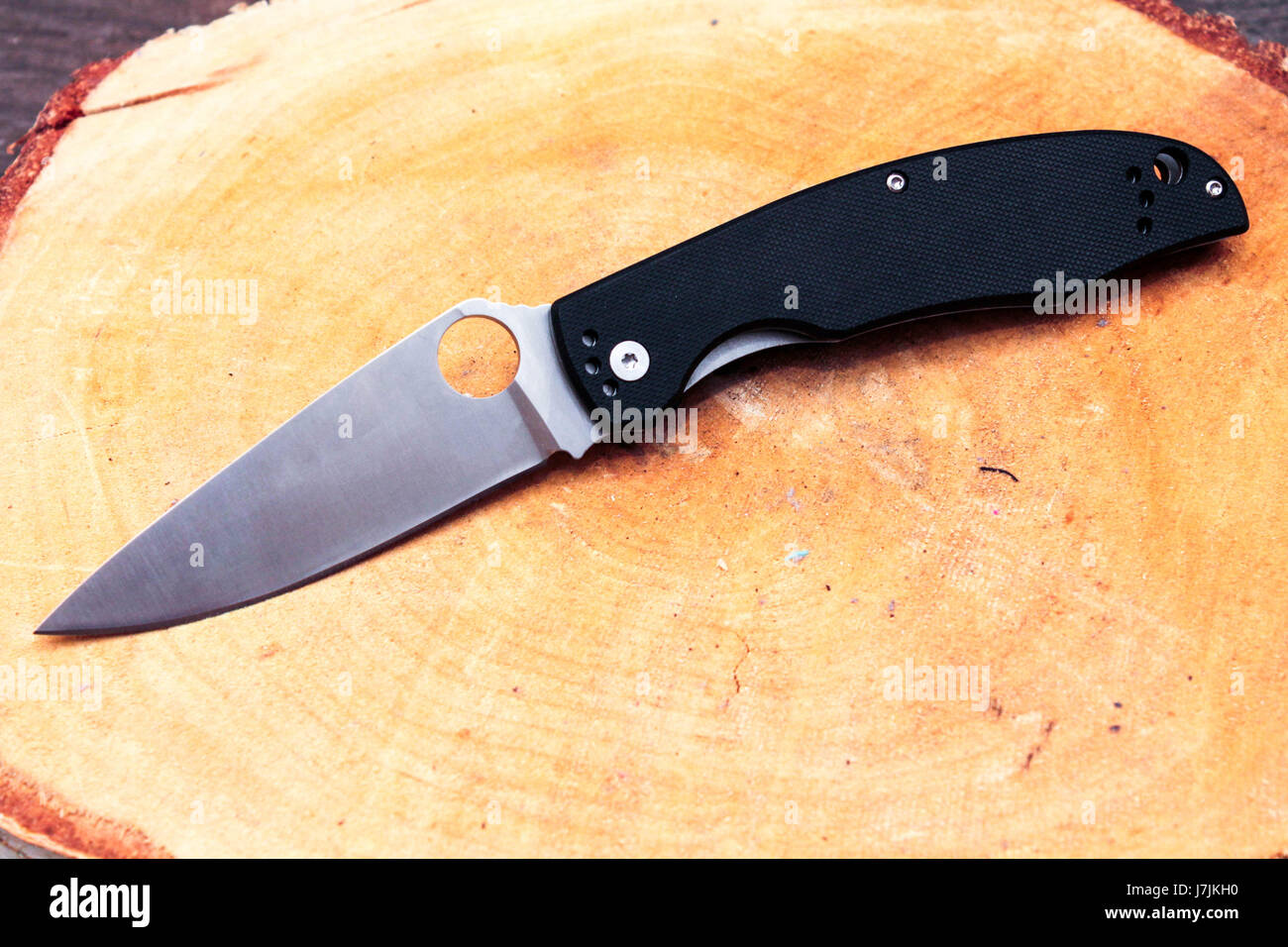 Knife with a triangular blade. White blade and black handle Stock Photo