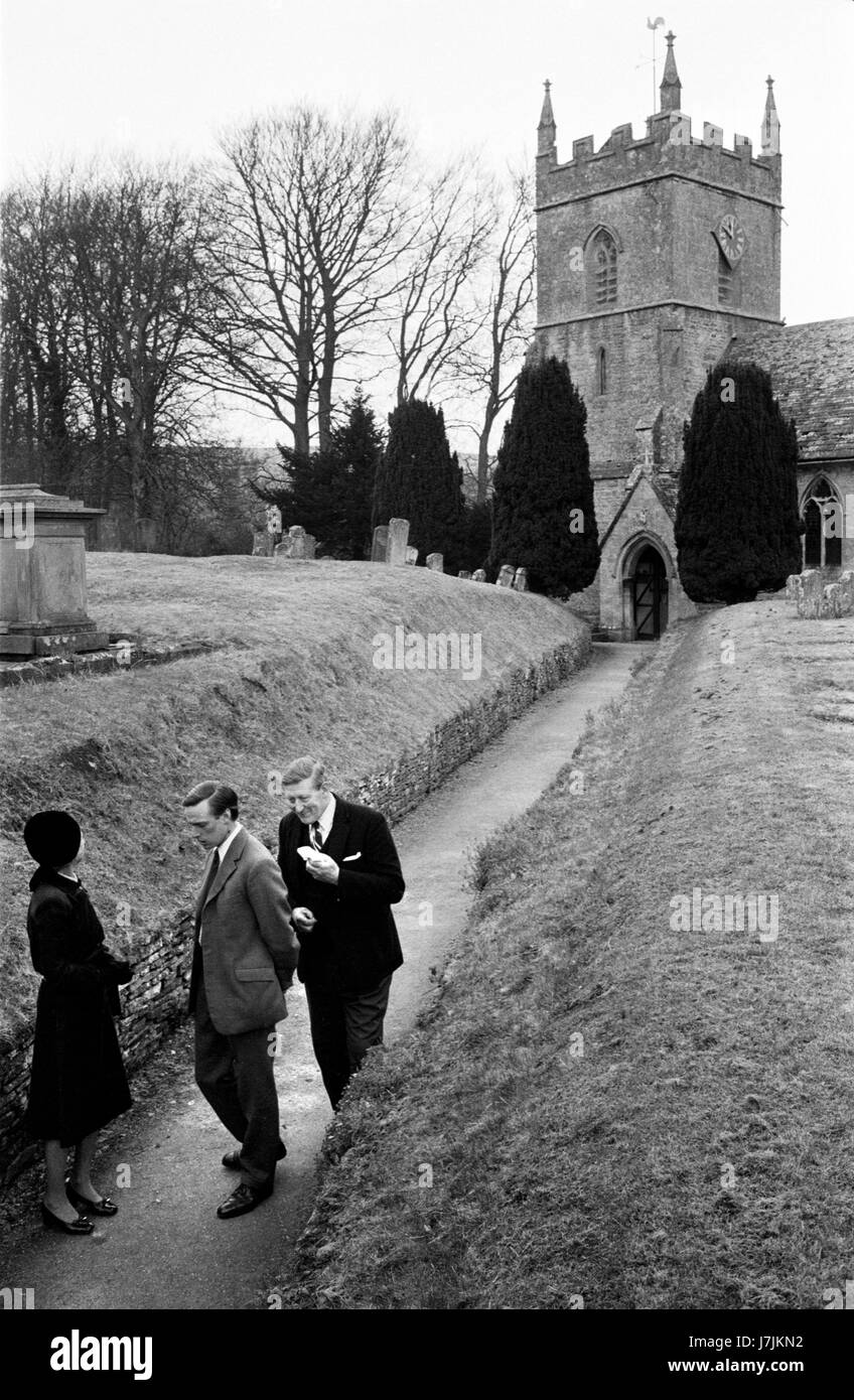 Village life 1975 UK St Peters Church of Saint Peter after Sunday morning service 1970s Britain UK. The Cotswolds. Lower and Upper Slaughter are twin villages on the River Eye and are know as The Slaughters.   HOMER SYKES Stock Photo