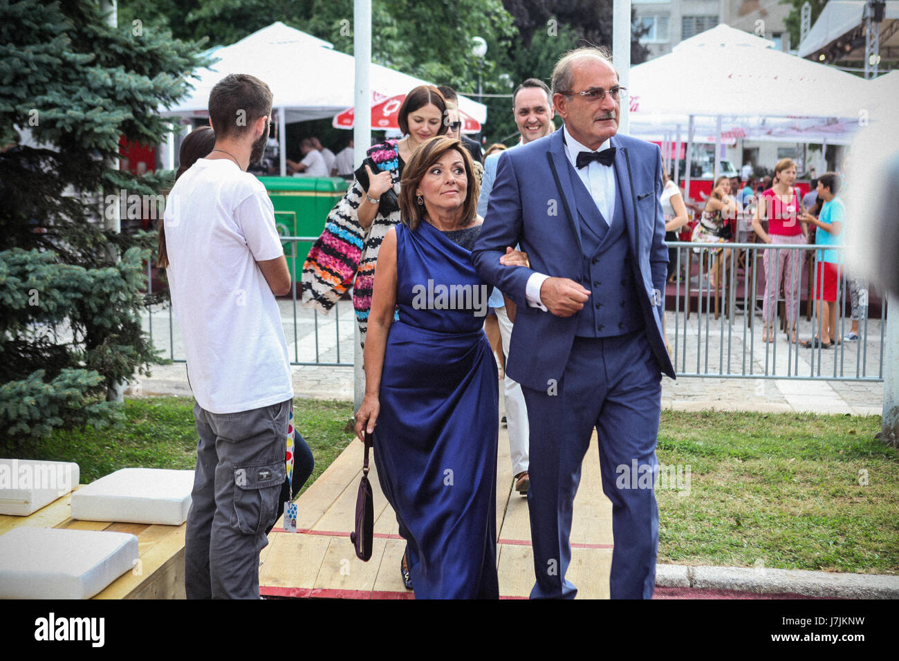 Nijaz Hastor (R) and his wife Mirsada Hastor (L) arrives in welcome drink before opening of 21st Sarajevo Film Festival in 2015. Stock Photo