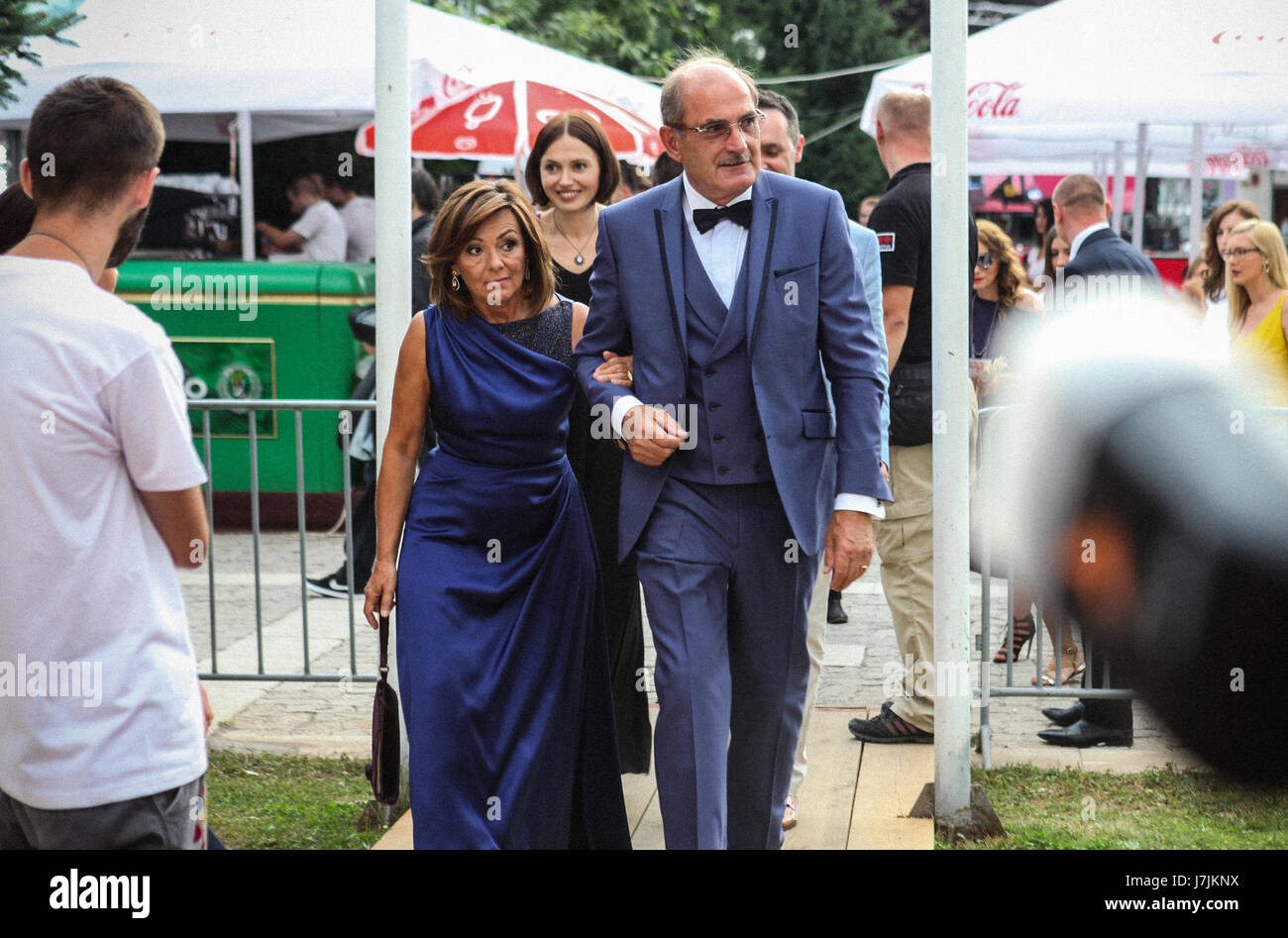 Nijaz Hastor (R) and his wife Mirsada Hastor (L) arrives in welcome drink before opening of 21st Sarajevo Film Festival in 2015. Stock Photo