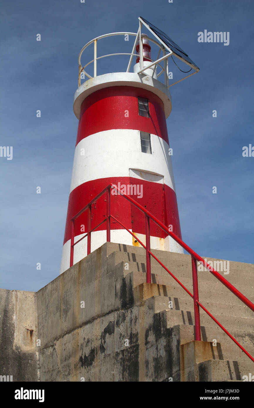 Red and white lighthouse at Sagres Port, Algarve, Portugal Stock Photo