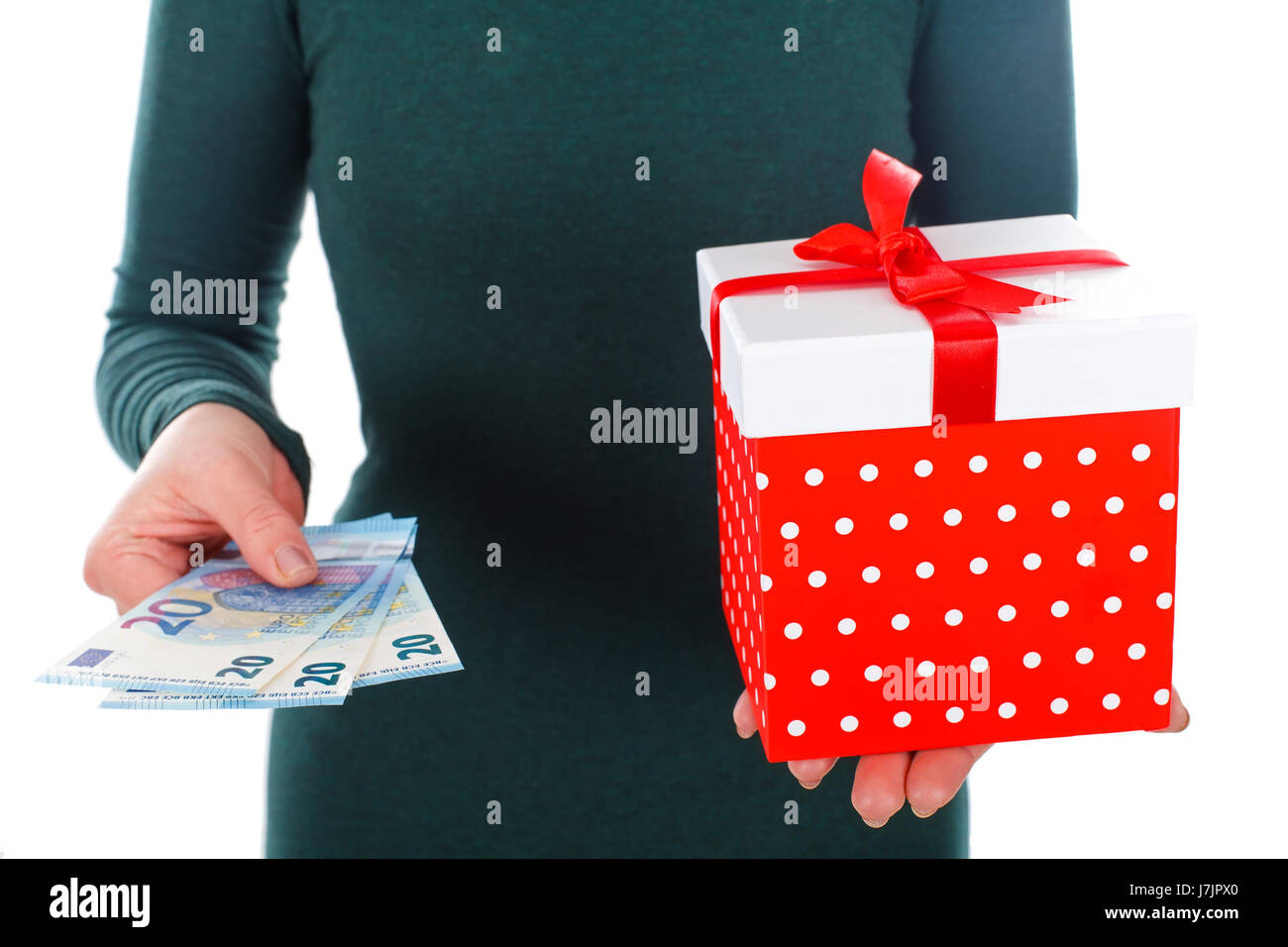 Close up picture of a woman holding a Christmas gift and money Stock ...